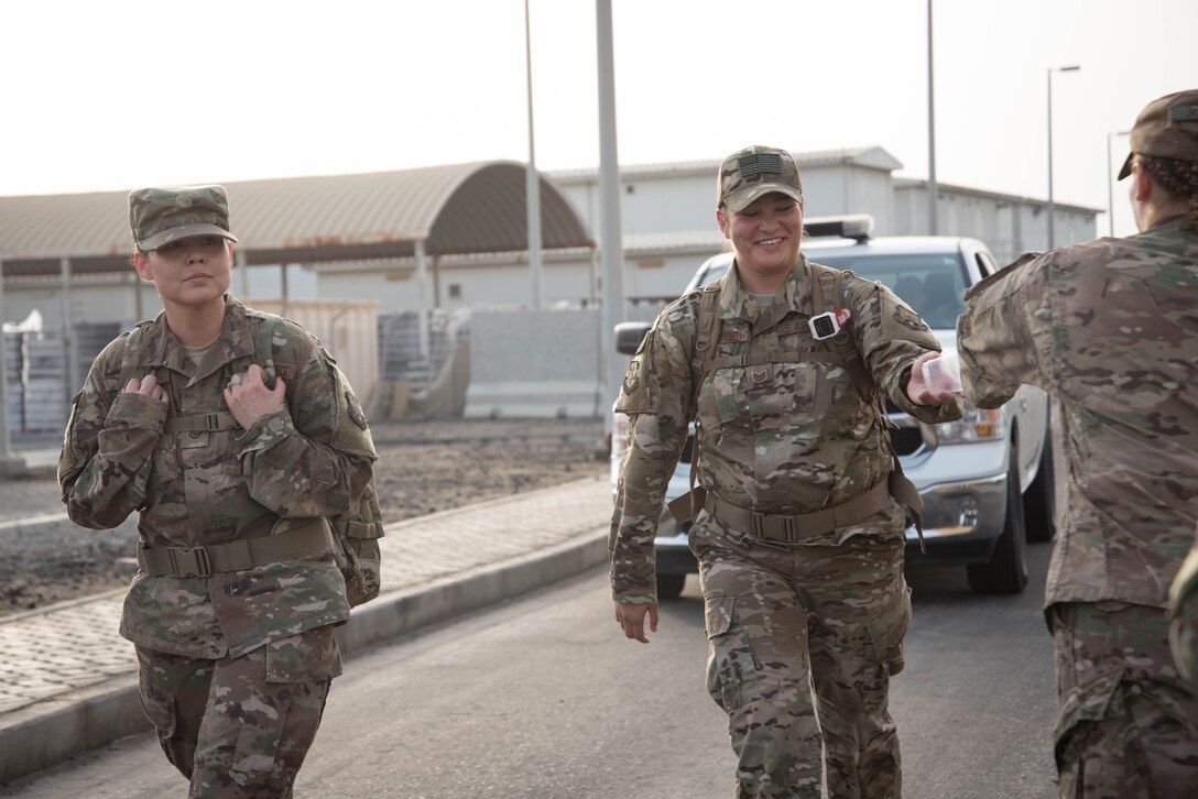 Members from Al Dhafra Air Base participate in a 5k run and ruck march in honor of National Police Week on Al Dhafra Air Base, United Arab Emirates, May 18, 2018. Participants carried bricks with names of fallen security forces officers.