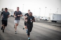 Members from Al Dhafra Air Base participate in a 5k run and ruck march in honor of National Police Week on Al Dhafra Air Base, United Arab Emirates, May 18, 2018. Participants carried bricks with names of fallen security forces officers.