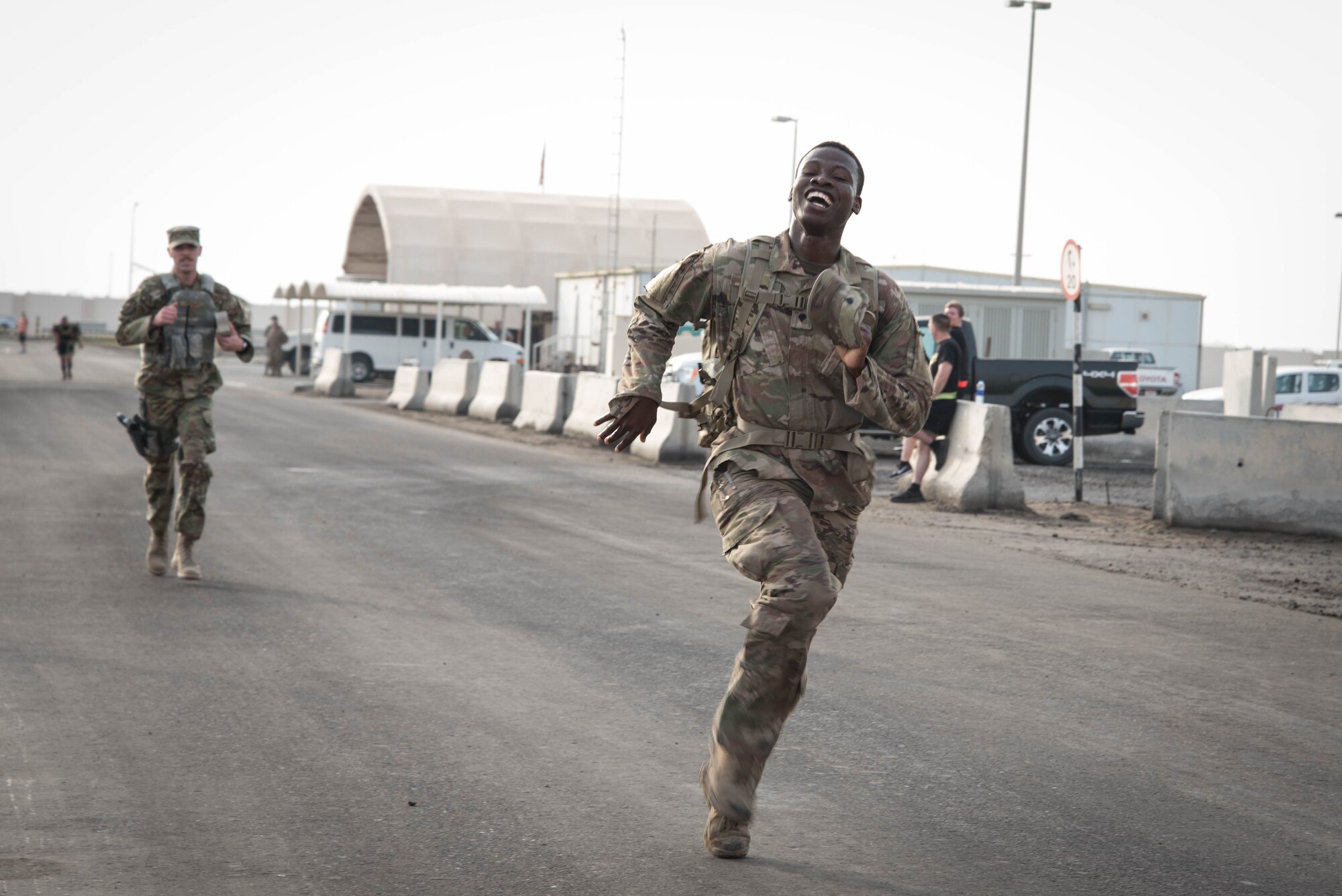 Members from Al Dhafra Air Base participate in a 5k run and ruck march in honor of National Police Week on Al Dhafra Air Base, United Arab Emirates, May 18, 2018. Participants carried bricks with names of fallen security forces officers.