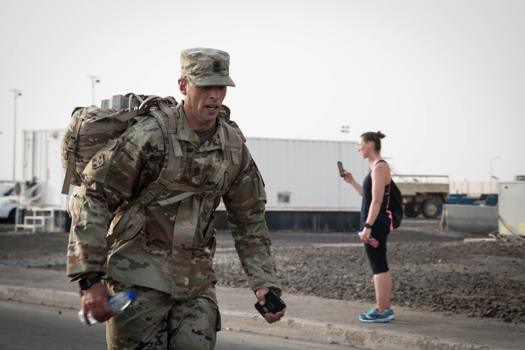 Members from Al Dhafra Air Base participate in a 5k run and ruck march in honor of National Police Week on Al Dhafra Air Base, United Arab Emirates, May 18, 2018. Participants carried bricks with names of fallen security forces officers.