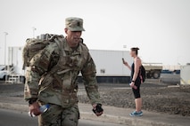 Members from Al Dhafra Air Base participate in a 5k run and ruck march in honor of National Police Week on Al Dhafra Air Base, United Arab Emirates, May 18, 2018. Participants carried bricks with names of fallen security forces officers.