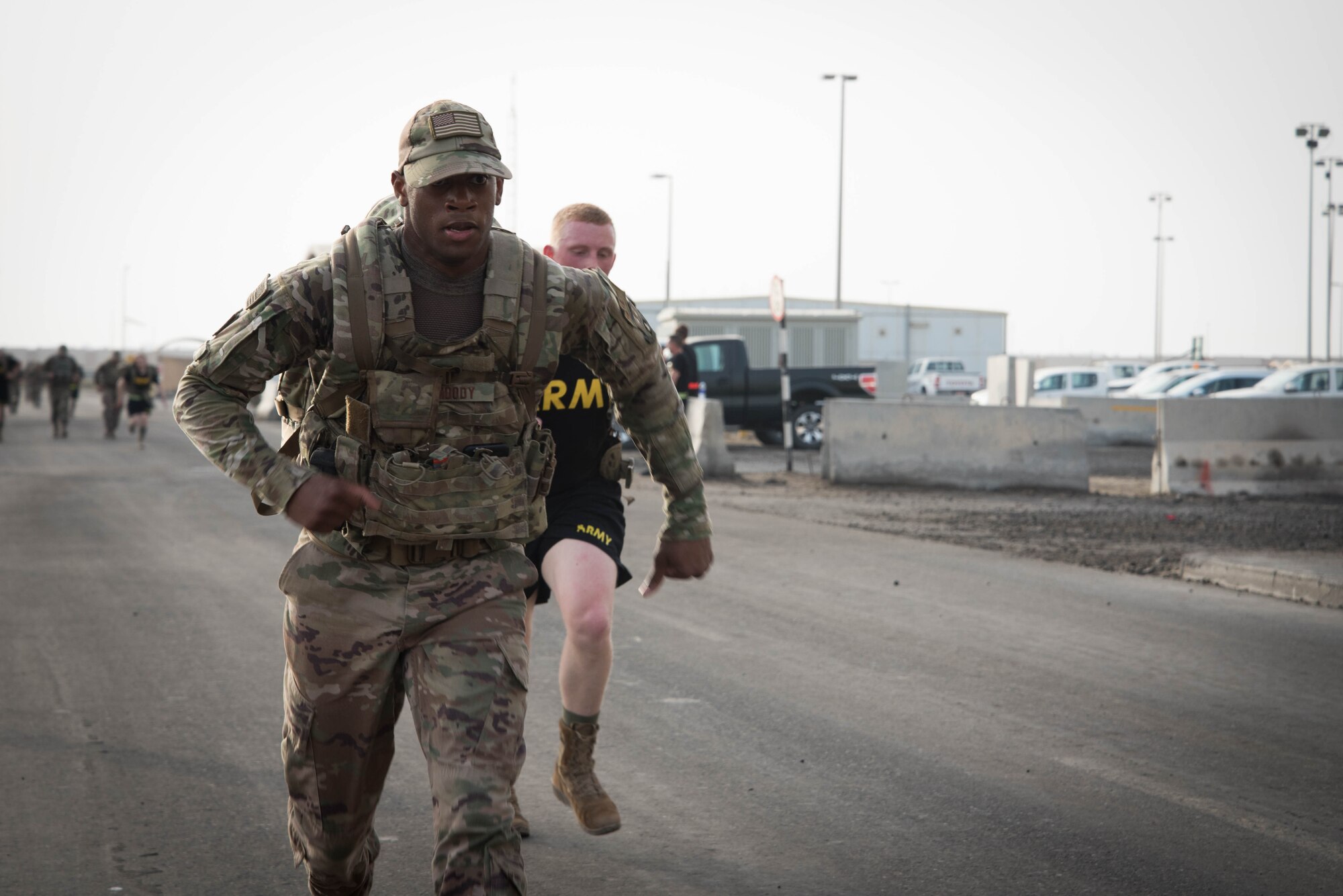 Members from Al Dhafra Air Base participate in a 5k run and ruck march in honor of National Police Week on Al Dhafra Air Base, United Arab Emirates, May 18, 2018. Participants carried bricks with names of fallen security forces officers.