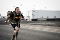 Members from Al Dhafra Air Base participate in a 5k run and ruck march in honor of National Police Week on Al Dhafra Air Base, United Arab Emirates, May 18, 2018. Participants carried bricks with names of fallen security forces officers.
