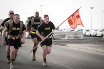 Members from Al Dhafra Air Base participate in a 5k run and ruck march in honor of National Police Week on Al Dhafra Air Base, United Arab Emirates, May 18, 2018. Participants carried bricks with names of fallen security forces officers.