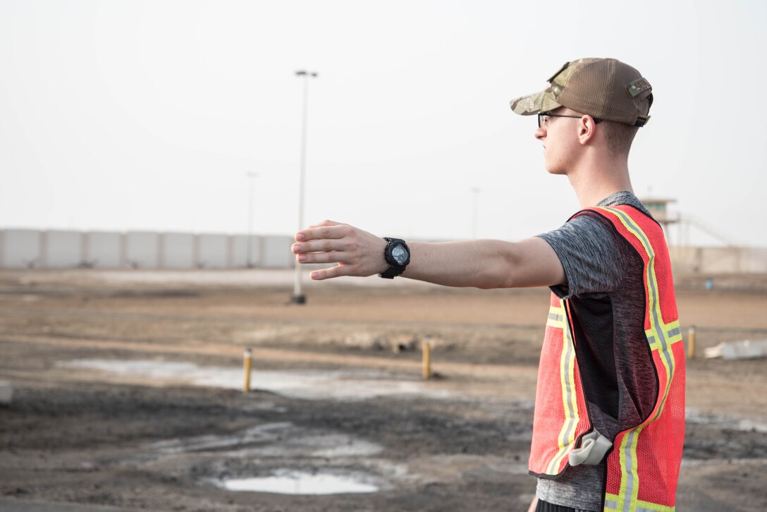 Members from Al Dhafra Air Base participate in a 5k run and ruck march in honor of National Police Week on Al Dhafra Air Base, United Arab Emirates, May 18, 2018. Participants carried bricks with names of fallen security forces officers.