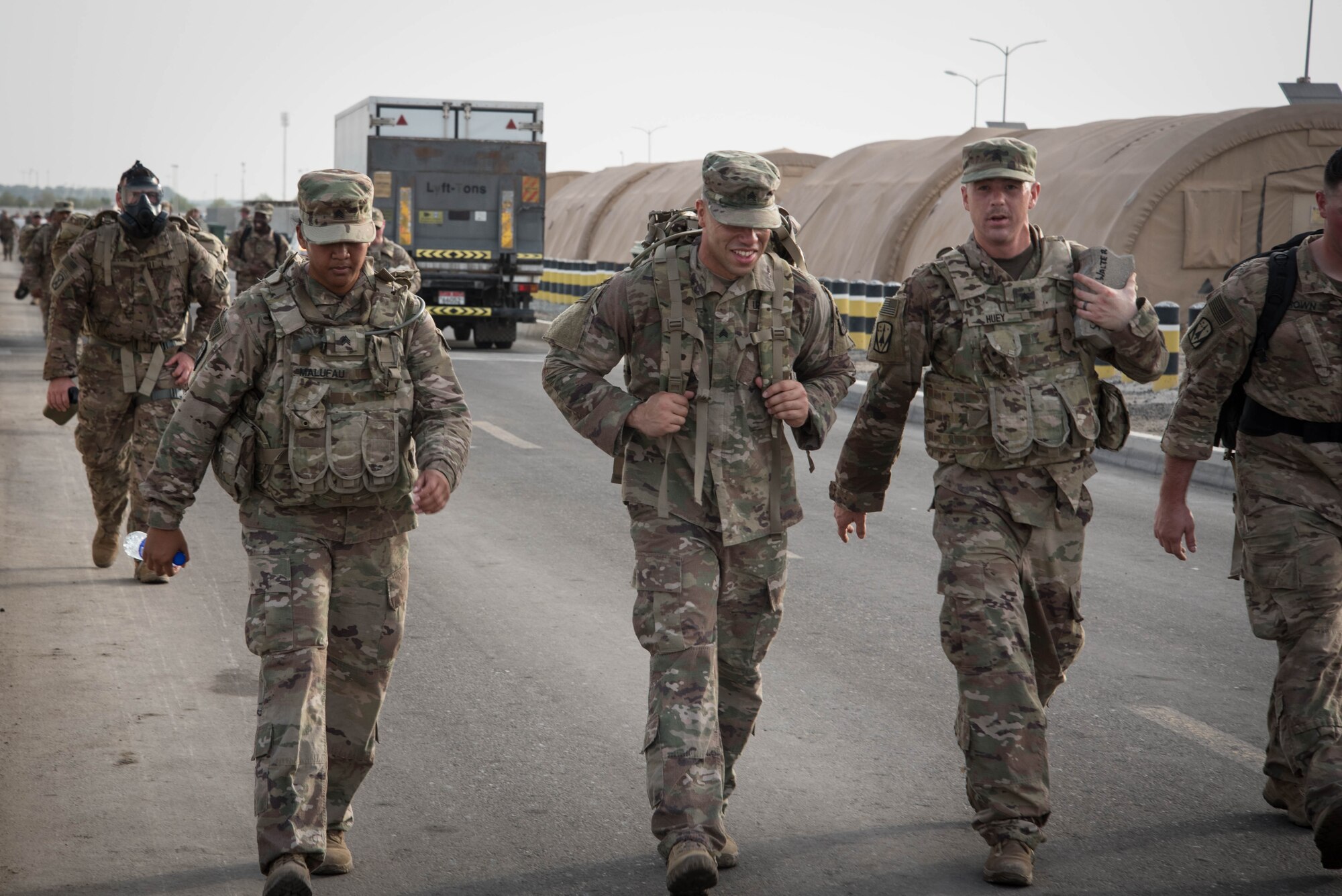 Members from Al Dhafra Air Base participate in a 5k run and ruck march in honor of National Police Week on Al Dhafra Air Base, United Arab Emirates, May 18, 2018. Participants carried bricks with names of fallen security forces officers.
