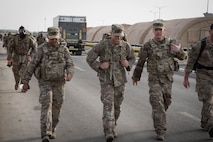 Members from Al Dhafra Air Base participate in a 5k run and ruck march in honor of National Police Week on Al Dhafra Air Base, United Arab Emirates, May 18, 2018. Participants carried bricks with names of fallen security forces officers.