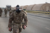 Members from Al Dhafra Air Base participate in a 5k run and ruck march in honor of National Police Week on Al Dhafra Air Base, United Arab Emirates, May 18, 2018. Participants carried bricks with names of fallen security forces officers.