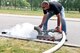 Volker Gehres, water-plant mechanic, 786th CES, flushes out a gutter near a fire hydrant on Ramstein Air Base, Germany, May, 9, 2018. Gehres has worked for the water plant for 15 years.