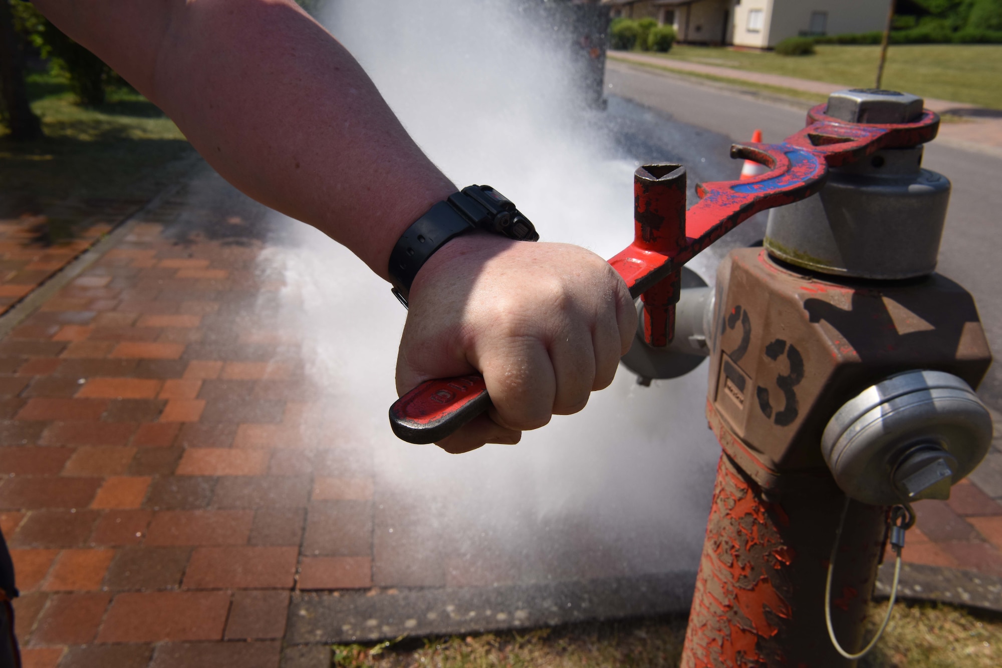 Thomas Bredel, water-plant mechanic, 786th CES, turns the wrench to test the water pressure of a fire hydrant on Ramstein Air Base, Germany, May, 9, 2018. Bredel has worked for the water plant for 5 years and likes that this part of his job allows the fire department to be prepared in case of emergencies.