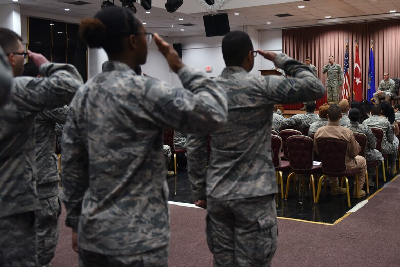 U.S. Air Force Col. Christopher Estridge, 39th Medical Group commander, renders his first salute as commander to 39th MDG Airmen at Incirlik Air Base, Turkey, May 18, 2018.