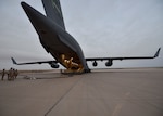 Members of the 379th Expeditionary Logistics Readiness Squadron offload JP8 jet fuel from a C-17 Globemaster III in an undisclosed location in Southwest Asia, May 11, 2018. This delivery is the first of its kind in more than a year and a half. (U.S Air Force photo by Staff Sgt. Enjoli Saunders)