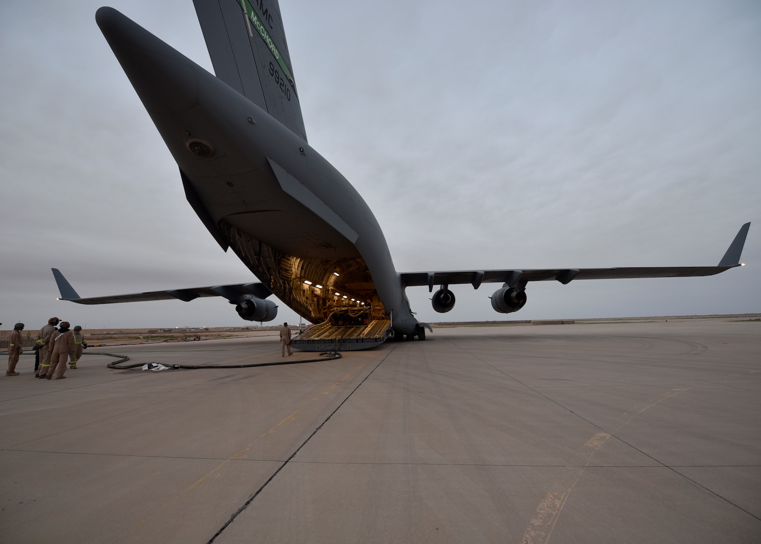 Members of the 379th Expeditionary Logistics Readiness Squadron offload JP8 jet fuel from a C-17 Globemaster III in an undisclosed location in Southwest Asia, May 11, 2018. This delivery is the first of its kind in more than a year and a half. (U.S Air Force photo by Staff Sgt. Enjoli Saunders)