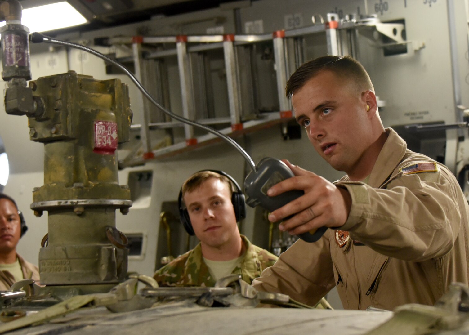 Airman 1st Class Tanner O'Laughlin monitors fume levels of a 2,800 gallon fuel bladder in an undisclosed location in Southwest Asia, May 11, 2018. This delivery is the first of its kind in more than a year and a half. (U.S Air Force photo by Staff Sgt. Enjoli Saunders)