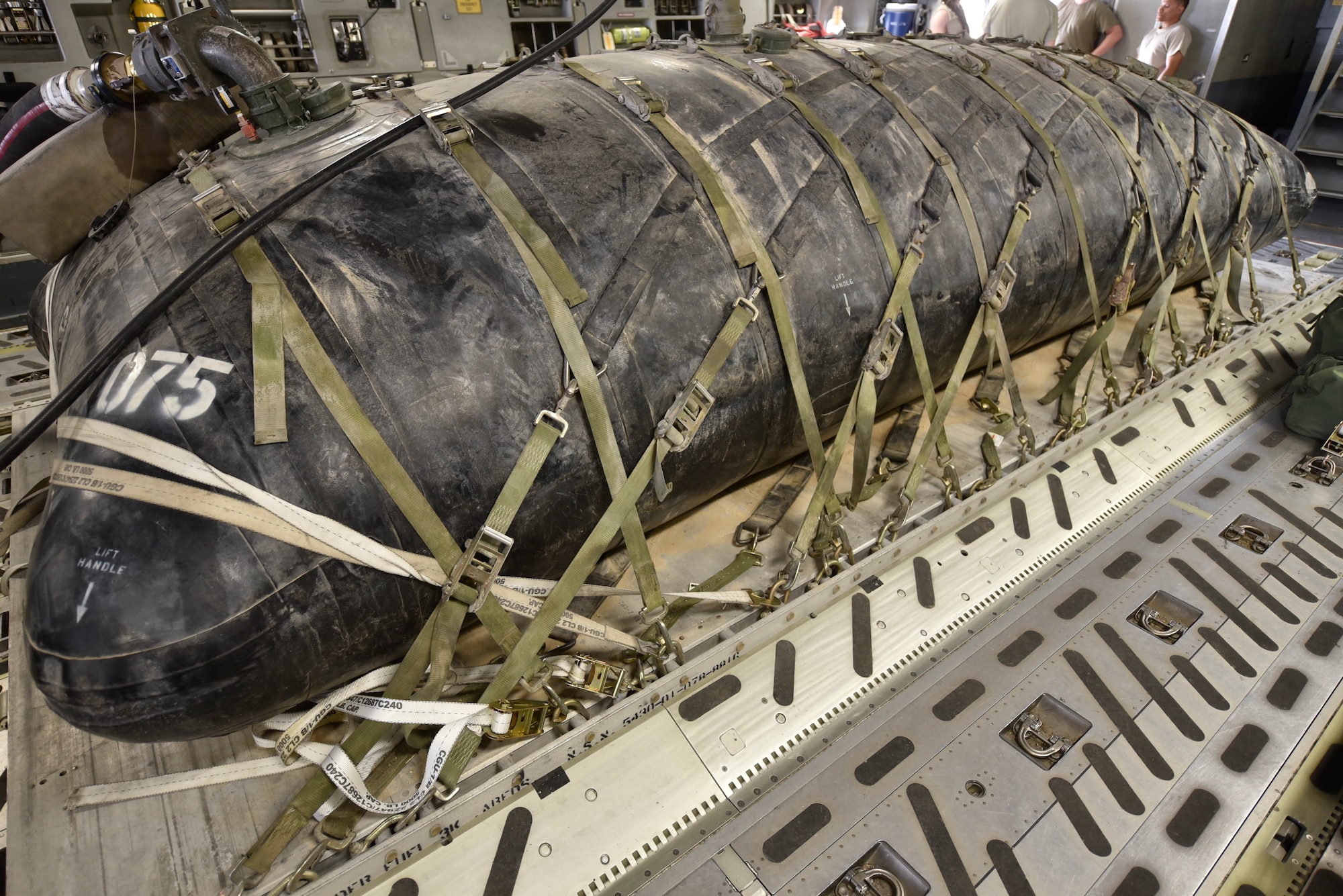 A 2,800 gallon bladder is tightly secured to a pallet prepared for fuel delivery to an undisclosed location in Southwest Asia, May 11, 2018. This delivery is the first of its kind in more than a year and a half. (U.S Air Force photo by Staff Sgt. Enjoli Saunders)