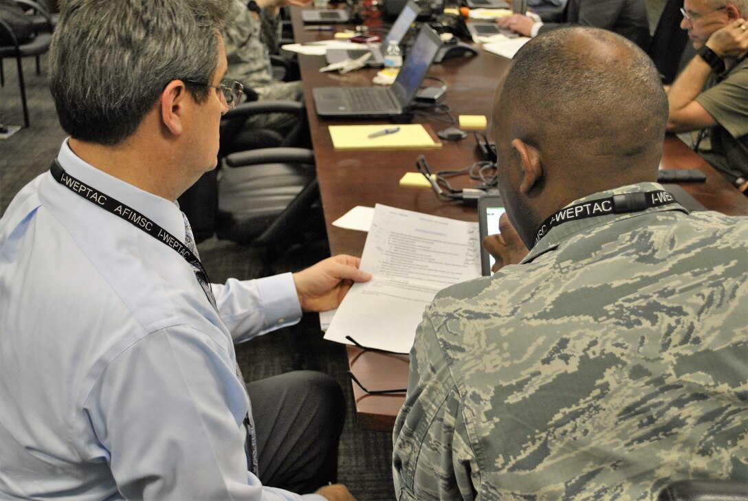 Members of one of four mission area working groups discuss the key points of their solution to a challenge facing the Air Force's agile combat support community. The MAWGs were the key components of the 2018 Installation and Mission Support Weapons and Tactics Conference. The annual conference was established in 2017 to get after pressing issues facing the Air Force and recommend solution sets to senior Air Force leaders. (U.S. Air Force photo by Armando Perez)