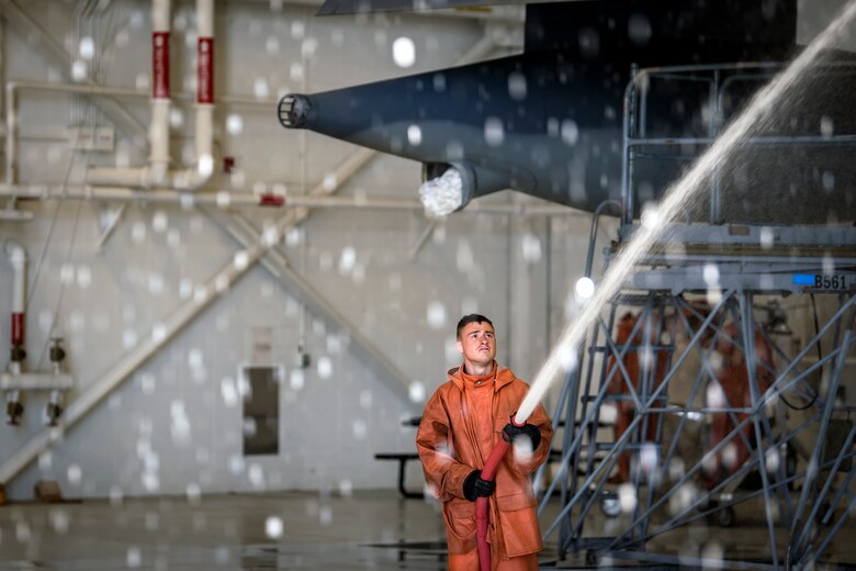 Senior Airman Aaron Brewer, 71st Aircraft Maintenance Unit crew chief, uses a power washer to clean an HC-130J Combat King II, May 7, 2018, at Moody Air Force Base, Ga. Upon return from a deployment or every 180 days, HC-130s are thoroughly cleaned and inspected as part of routine upkeep and to ensure components are in working condition. (U.S. Air Force photo by Airman 1st Class Eugene Oliver)