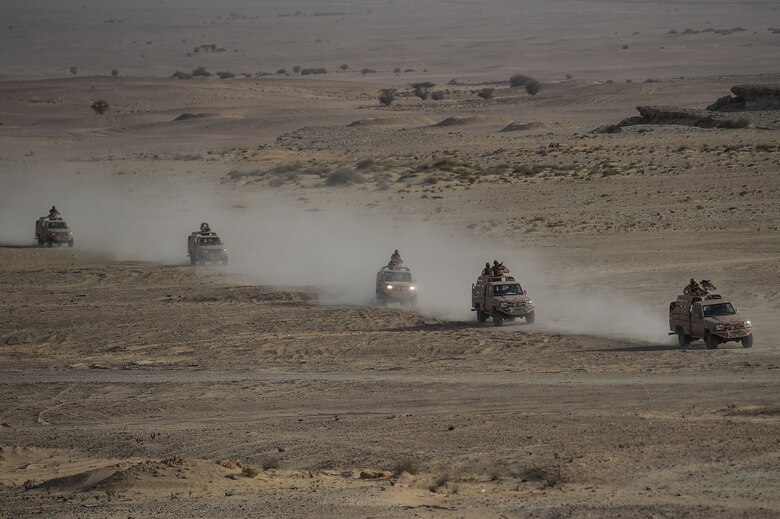 Qatar Armed Forces participate in the Qatar Emiri Air Force Lahoub exercise at Al-Qalael drop zone, Qatar, May 9, 2018. The U.S. and Qatar work together to foster military cooperation to strengthen and expand contributions to the coalition's fight against the Islamic State of Iraq and Syria. (U.S. Air Force photo by Staff Sgt. Corey Hook)