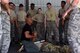 Billy Matheny, the senior combative instructor assigned to the 509th Security Forces Squadron, demonstrates a baton restraint technique to security forces Airmen May 15, 2018 at Whiteman Air Force Base, Mo.