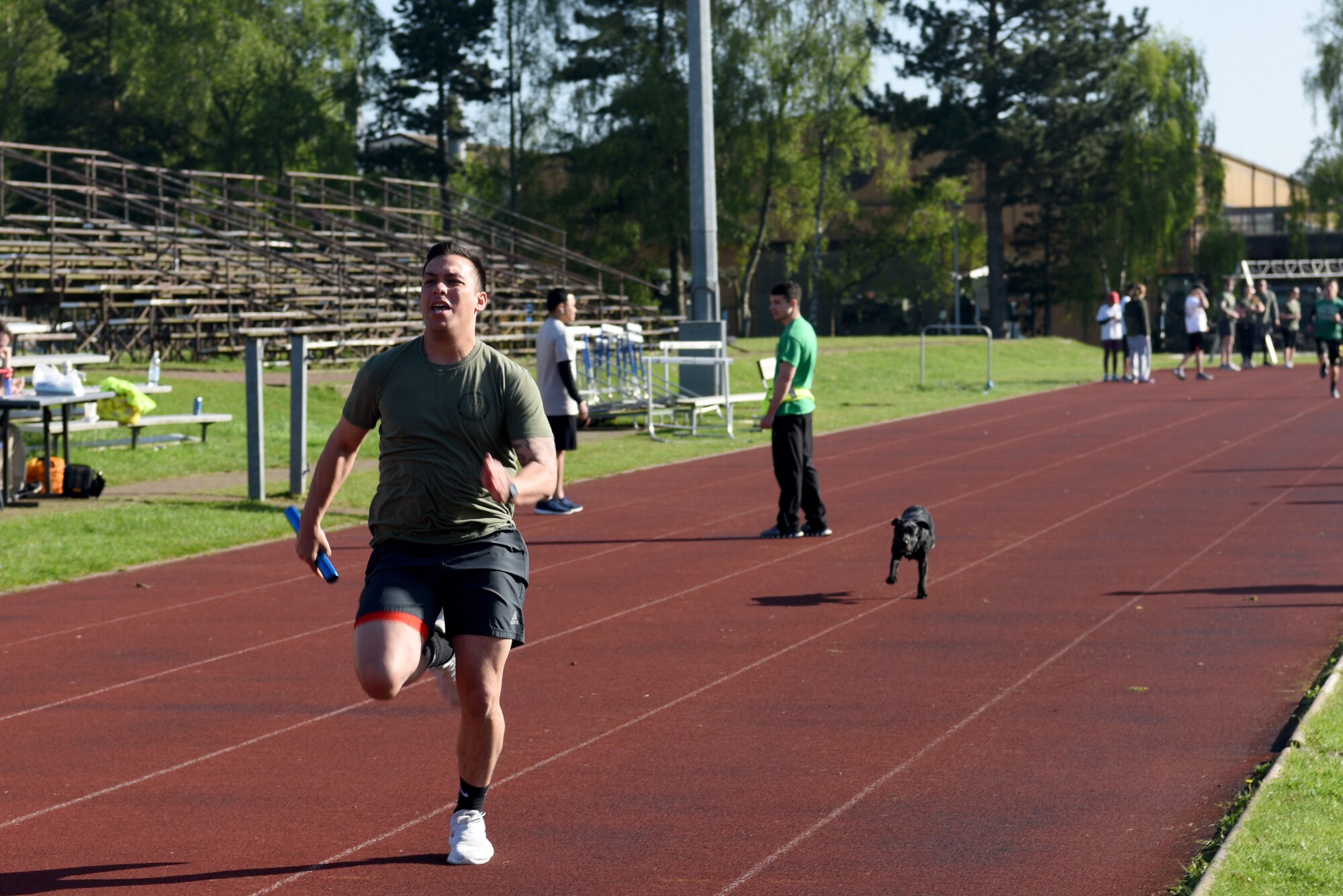 An Airman from the 48th Civil Engineer Squadron participates in a relay run as part of the 48th Force Support Squadron's "You Got Served" events at Royal Air Force Lakenheath, England, May 4, 2018. During the relay run participating squadrons recieved raffle tickets for cash prizes between $10 and $1,000. (U.S. Air Force Photo/ Airman 1st Class John A. Crawford)