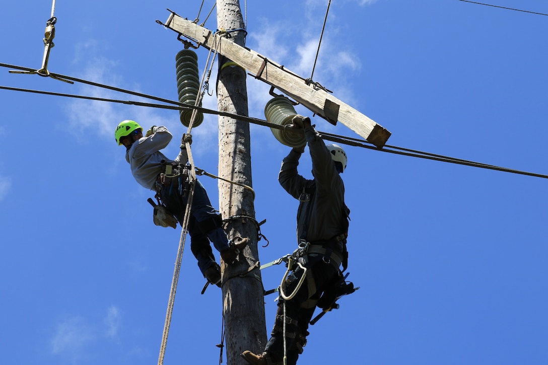 U.S. Army Corps of Engineers Task Force Power Restoration contractors complete work on a transmission line in the Guanica State Forest, Puerto Rico, April 6.