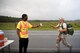 Airman 1st Class Robert Moses, 822d fireteam member, offers water to a participant during a Law Enforcement memorial 5k run and rucksack march, May 17, 2018, at Moody Air Force Base, Ga. President John F. Kennedy signed a proclamation in 1962 designating may 15 as Peace Officers Memorial Day.  Security Forces Members used Police Week to promote camaraderie and recognize all law enforcement members who have lost their lives in the line of duty. (U.S. Air Force photo by Senior Airman Daniel Snider)