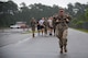 Staff Sgt. Elizabeth Patty, 820th command support staff member, carries her rucksack across the finish line of a Law Enforcement memorial 5k run and rucksack march, May 17, 2018, at Moody Air Force Base, Ga.Security Forces Members used Police Week to promote camaraderie and recognize all law enforcement members who have lost their lives in the line of duty. (U.S. Air Force photo by Senior Airman Daniel Snider)