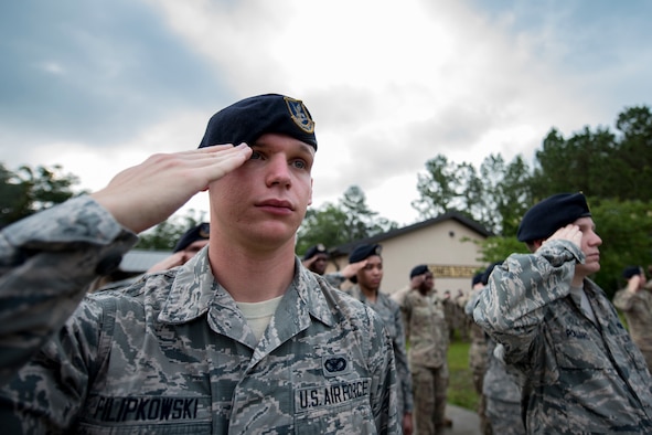 Senior Airman Michael Filipkowski, 23d Security Forces Squadron training instructor, renders a salute during the closing ceremony of National Police Week, May 18, 2018, at Moody Air Force Base, Ga. President John F. Kennedy signed a proclamation in 1962 designating may 15 as Peace Officers Memorial Day.  Security Forces Members used Police Week to promote camaraderie and recognize all law enforcement members who have lost their lives in the line of duty. (U.S. Air Force photo by Senior Airman Daniel Snider)