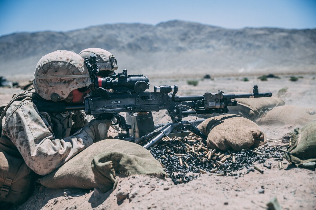Marines with 3rd Battalion, 2nd Marine Regiment, 2nd Marine Division, fire at the enemy targets during the Regiment Assault Course at Training Area Quackenbush as a part of Integrated Training Exercise 3-18 aboard the Marine Corps Air Ground Combat Center, Twentynine Palms, Calif., May 15, 2018. The purpose of ITX is to create a challenging, realistic training environment that produces combat-ready forces capable of operating as an integrated Marine Air Ground Task Force. (U.S. Marine Corps photo by Lance Cpl. William Chockey)