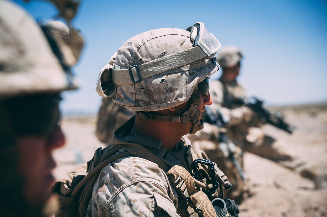 Marines with 3rd Battalion, 2nd Marine Regiment, 2nd Marine Division, wait for the rest of their squad before entering the Amphibious Assault Vehicle during the Regiment Assault Course at Training Area Quackenbush as a part of Integrated Training Exercise 3-18 aboard the Marine Corps Air Ground Combat Center, Twentynine Palms, Calif., May 15, 2018. The purpose of ITX is to create a challenging, realistic training environment that produces combat-ready forces capable of operating as an integrated Marine Air Ground Task Force. (U.S. Marine Corps photo by Lance Cpl. William Chockey)