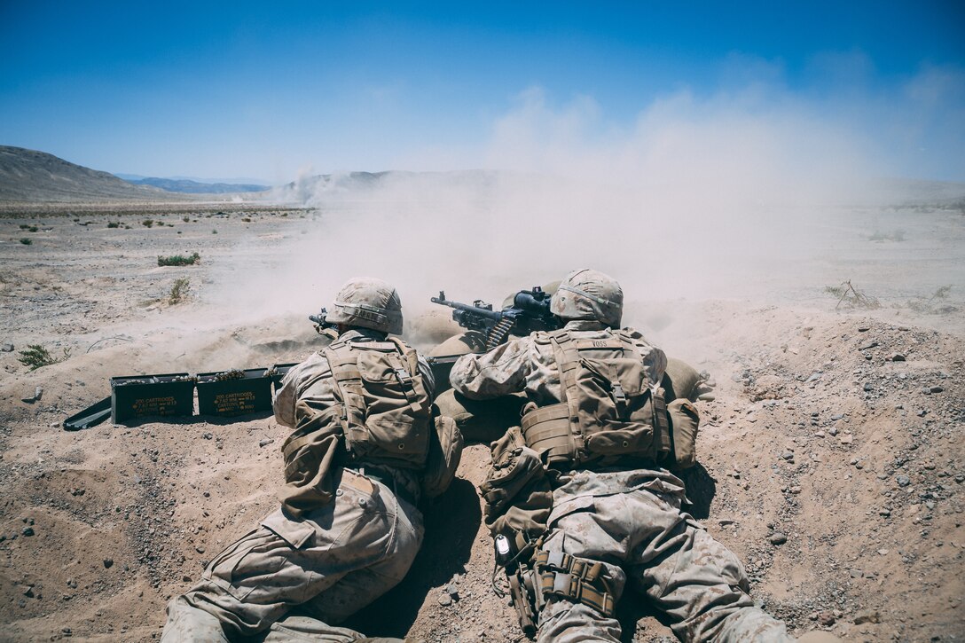 Marines with 3rd Battalion, 2nd Marine Regiment, 2nd Marine Division, fire at the enemy targets during the Regiment Assault Course at Training Area Quackenbush as a part of Integrated Training Exercise 3-18 aboard the Marine Corps Air Ground Combat Center, Twentynine Palms, Calif., May 15, 2018. The purpose of ITX is to create a challenging, realistic training environment that produces combat-ready forces capable of operating as an integrated Marine Air Ground Task Force. (U.S. Marine Corps photo by Lance Cpl. William Chockey)
