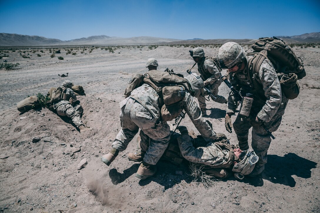 Marines with 3rd Battalion, 2nd Marine Regiment, 2nd Marine Division, sprint to a cherry picker during the Regiment Assault Course at Training Area Quackenbush as a part of Integrated Training Exercise 3-18 aboard the Marine Corps Air Ground Combat Center, Twentynine Palms, Calif., May 15, 2018. The purpose of ITX is to create a challenging, realistic training environment that produces combat-ready forces capable of operating as an integrated Marine Air Ground Task Force. (U.S. Marine Corps photo by Lance Cpl. William Chockey)