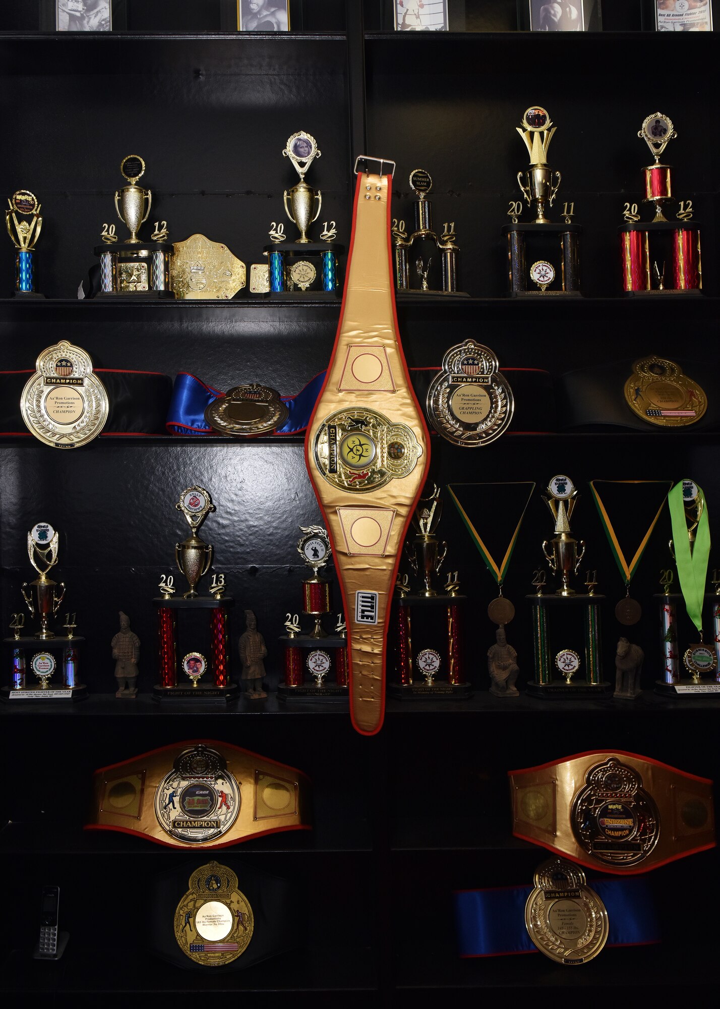 The trophy case highlights the accomplishments of Billy Matheny’s students at his mixed martial arts studio in Warrensburg, Mo. May 1, 2018.