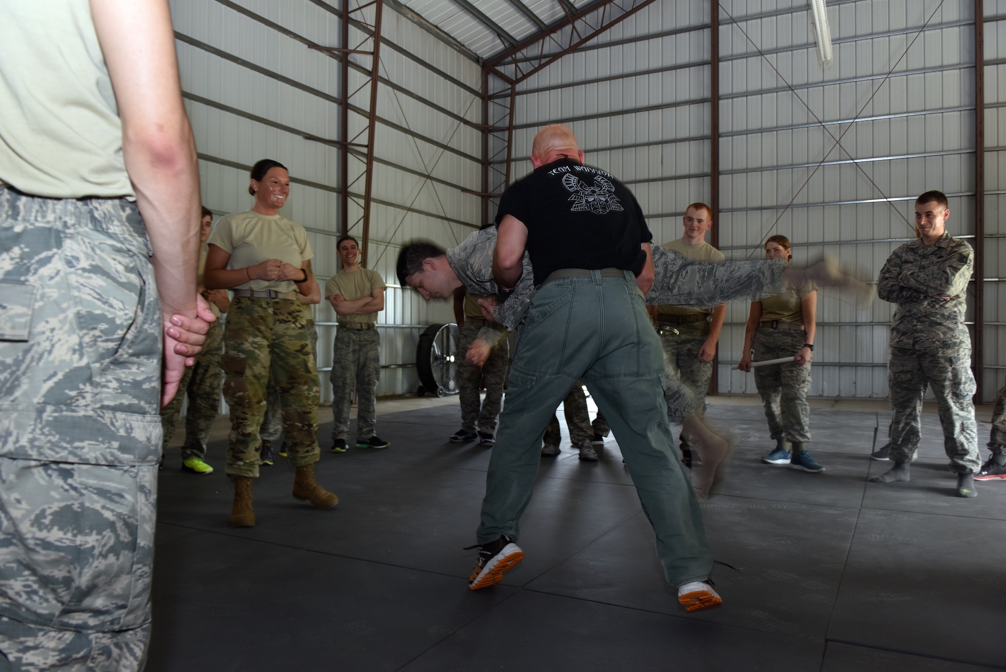 Billy Matheny, the senior combative instructor assigned to the 509th Security Forces Squadron, demonstrates a baton restraint technique to security forces Airmen May 15, 2018 at Whiteman Air Force Base, Mo.