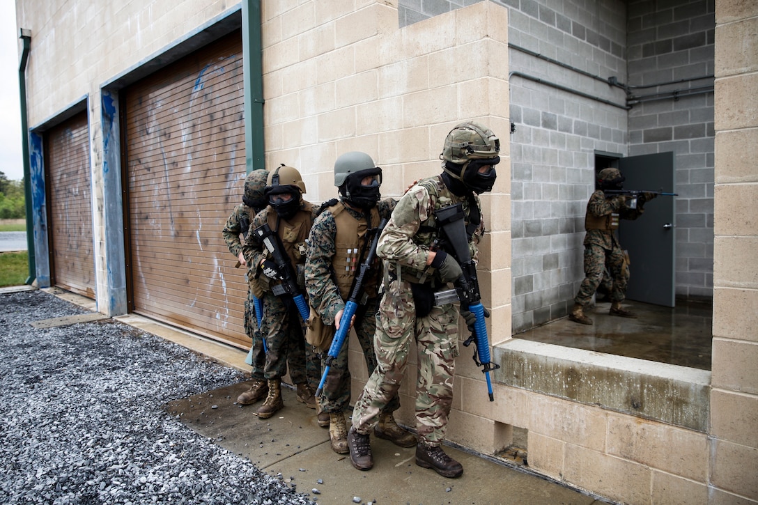 U.S. Marines with 6th Engineer Support Battalion, 4th Marine Logistics Group, and British commando’s with 131 Commando Squadron Royal Engineers, British Army, clear a building during a simulated live scenario at the military operations on urbanized terrain, or MOUT structure, during exercise Red Dagger at Fort Indiantown Gap, Pa., May 17, 2018.