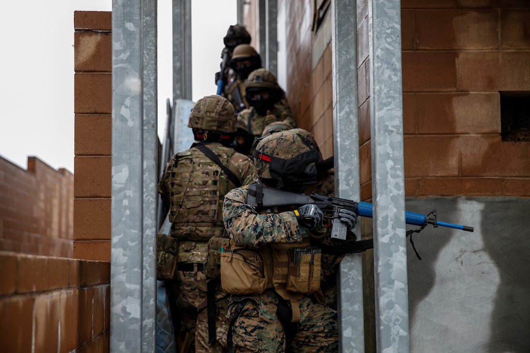 U.S. Marines with 6th Engineer Support Battalion, 4th Marine Logistics Group, and British commando’s with 131 Commando Squadron Royal Engineers, British Army, clear a building during a simulated live scenario at the military operations on urbanized terrain, or MOUT structure, during exercise Red Dagger at Fort Indiantown Gap, Pa., May 17, 2018.