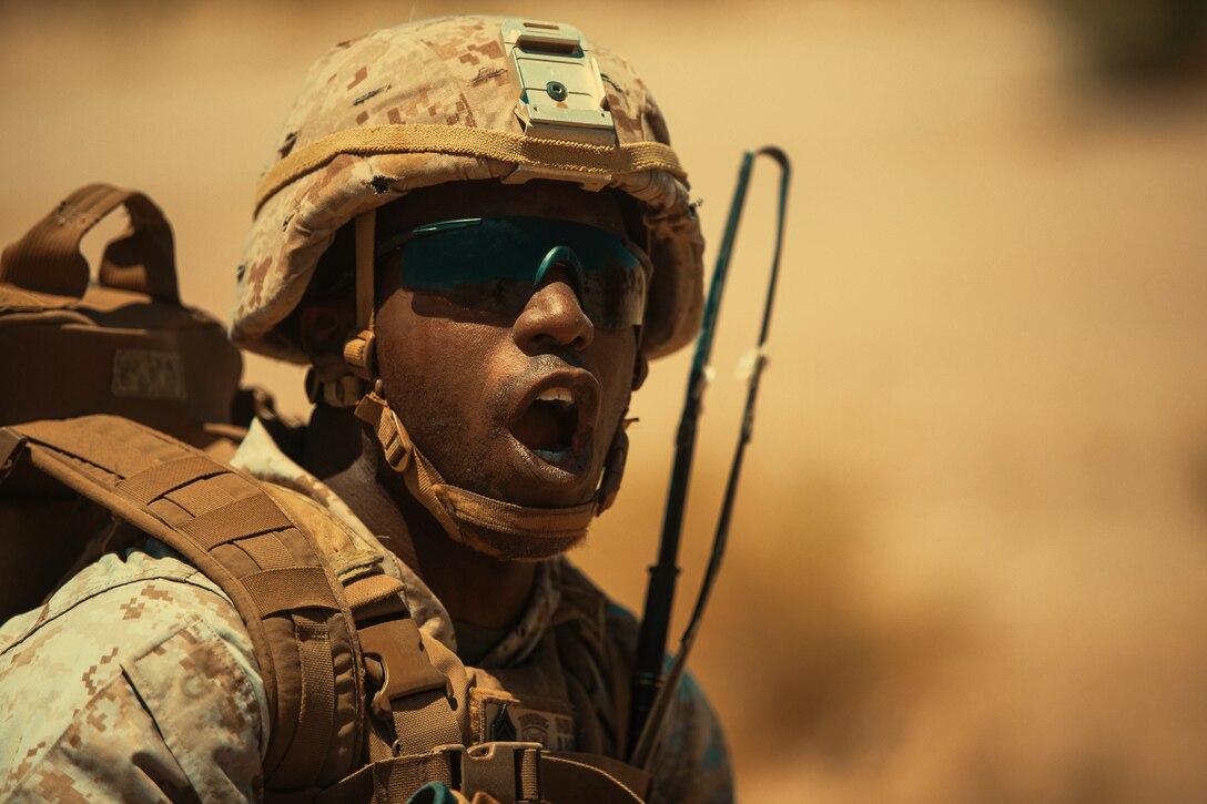 A Marine with 3rd Battalion, 4th Marines, 7th Marine Regiment, commands his fellow Marines during an aerial assault course as part of Integrated Training Exercise 3-18 aboard the Marine Corps Air Ground Combat Center, Twentynine Palms, Calif., May 10, 2018. The purpose of ITX is to create a challenging, realistic training environment that produces combat-ready forces capable of operating as an integrated Marine Air Ground Task Force. (U.S. Marine Corps photo by Lance Cpl. Isaac Cantrell)