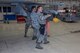 A fighter weapons crew consisting of Staff Sgt. Robert Wagner, Staff Sgt. Michael Meyer and Staff Sgt. Cody McCloud loaded an AIM-9X short-range, air-to-air mis¬sile on an F-16 Fighting Falcon. The 200-pound missile is loaded manually and it’s imperative to load the weapon quickly and safely to be mission ready. (U.S. Air Force photo by Matt Williams)