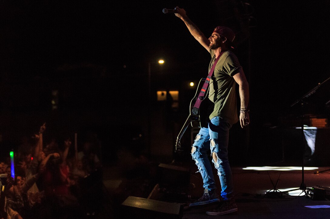 Canaan Smith, a country music artist, performs at the 15th annual We Salute You Celebration aboard the Marine Corps Air Ground Combat Center, Twentynine Palms, Calif., May 12, 2018. The annual event is held to thank military members aboard the Combat Center for their service and featured a free live music concert, games, activities, food and beverages. (U.S. Marine Corps photo by Lance Cpl. Rachel K. Porter)