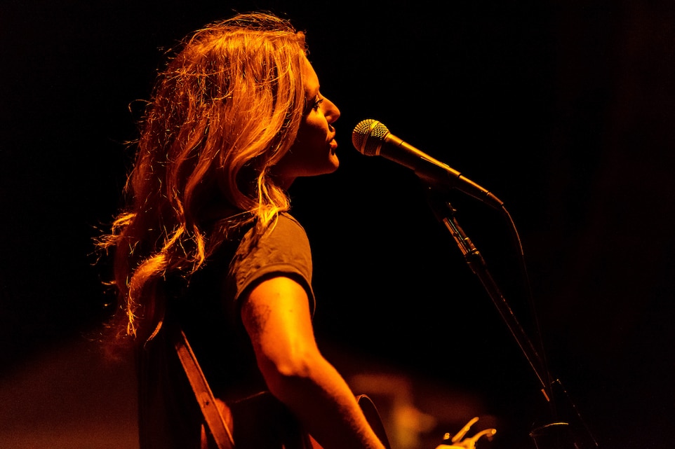 Hannah Mulholland, a musical artist with the band Runaway June, performs at the 15th annual We Salute You Celebration aboard the Marine Corps Air Ground Combat Center, Twentynine Palms, Calif., May 12, 2018. The annual event is held to thank military members aboard the Combat Center for their service and featured a free live music concert, games, activities, food and beverages. (U.S. Marine Corps photo by Lance Cpl. Rachel K. Porter)