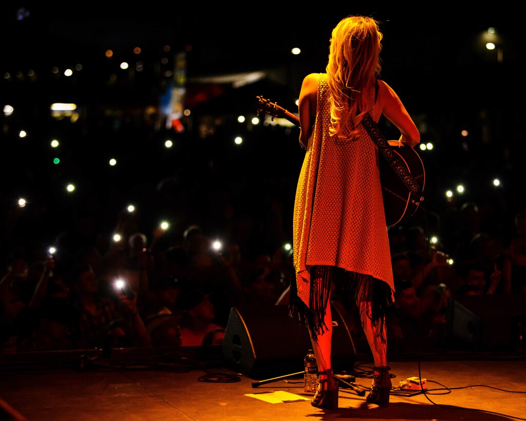 Jennifer Wayne, a musical artist with the band Runaway June, performs at the 15th annual We Salute You Celebration aboard the Marine Corps Air Ground Combat Center, Twentynine Palms, Calif., May 12, 2018. The annual event is held to thank military members aboard the Combat Center for their service and featured a free live music concert, games, activities, food and beverages. (U.S. Marine Corps photo by Lance Cpl. Rachel K. Porter)