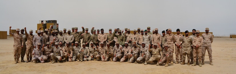 More than 45 KLF and U.S. soldiers celebrate completion of a joint training April 25, 2018. The training encompassed Chemical Biological Radiological Nuclear (CBRN) operational decontamination, information exchange, Tactics, Techniques, and Procedures (TTP) of Mission Oriented Protective Posture (MOPP) gear exchange, as well as vehicle decontamination procedures, and assessment of joint capabilities and opportunities for seamless interoperability in the event of a potential future weapons of mass destruction (WMD) event.