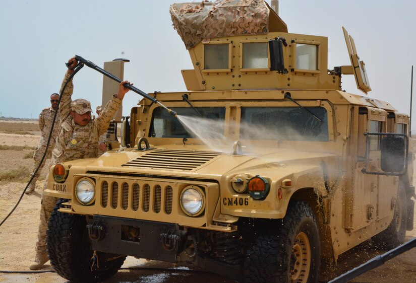 More than 45 U.S. and Kuwait Land Forces soldiers took part in a joint partner training opportunity April 25, 2018. In the simulation, a vehicle was treated as though it were contaminated by a radiological weapon of mass destruction. The team of soldiers systematically decontaminated the vehicle together, using an M-26 joint service pump during a joint partner training scenario. Subsequently the operator as well as the vehicle occupants performed Mission Oriented Protective Posture (MOPP) gear exchange at a nearby area.