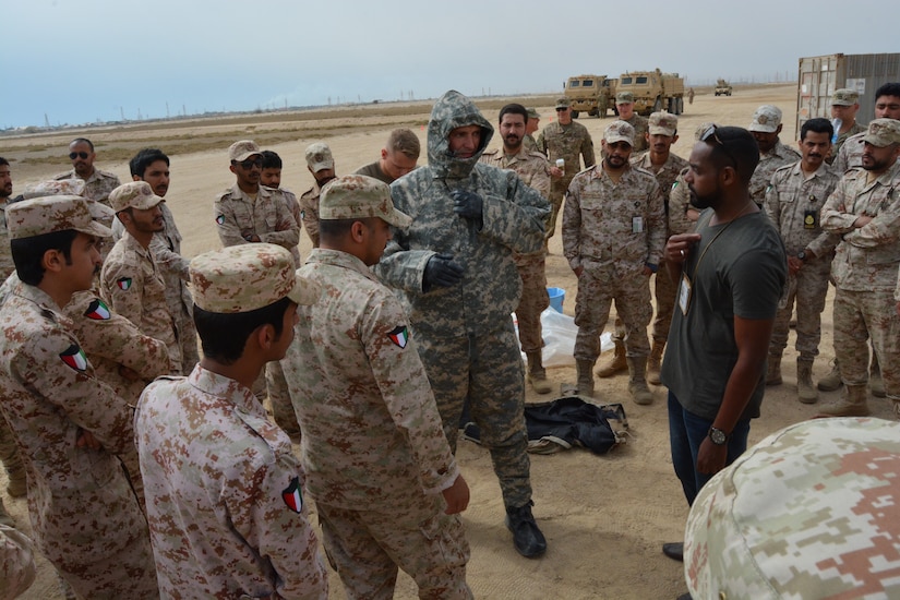 More than 45 U.S. and Kuwait Land Forces soldiers share Tactics, Techniques, and Procedures (TTPs) for Mission Oriented Protective Posture (MOPP) gear exchange and vehicle decontamination procedures during a joint partner training opportunity, April 25, 2018.