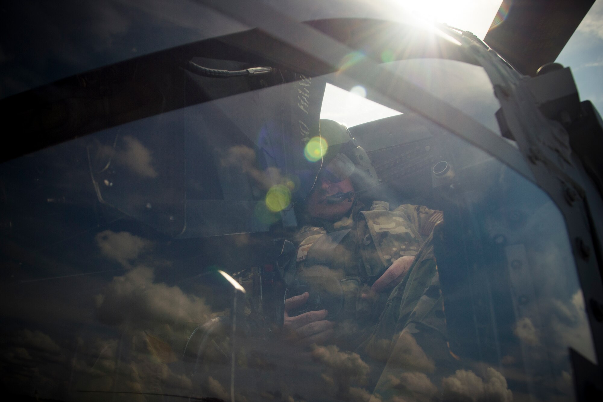 A pilot from the 41st Rescue Squadron buckles himself in prior to flying an HH-60G Pave Hawk, May 17, 2018, at Moody Air Force Base, Ga. Airmen conduct routine training missions in the airspace surrounding Moody to remain current on their tactics and procedures. While helping pilots remain proficient, training also gives crew chiefs and maintainers the opportunity to remain proficient at launching and maintaining the aircraft. (U.S. Air Force photo by Senior Airman Janiqua P. Robinson)