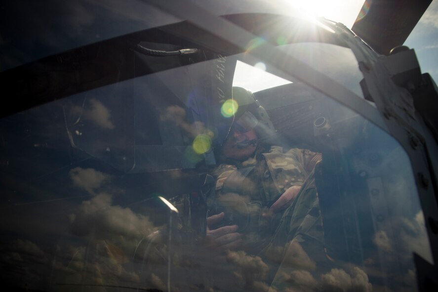 A pilot from the 41st Rescue Squadron buckles himself in prior to flying an HH-60G Pave Hawk, May 17, 2018, at Moody Air Force Base, Ga. Airmen conduct routine training missions in the airspace surrounding Moody to remain current on their tactics and procedures. While helping pilots remain proficient, training also gives crew chiefs and maintainers the opportunity to remain proficient at launching and maintaining the aircraft. (U.S. Air Force photo by Senior Airman Janiqua P. Robinson)