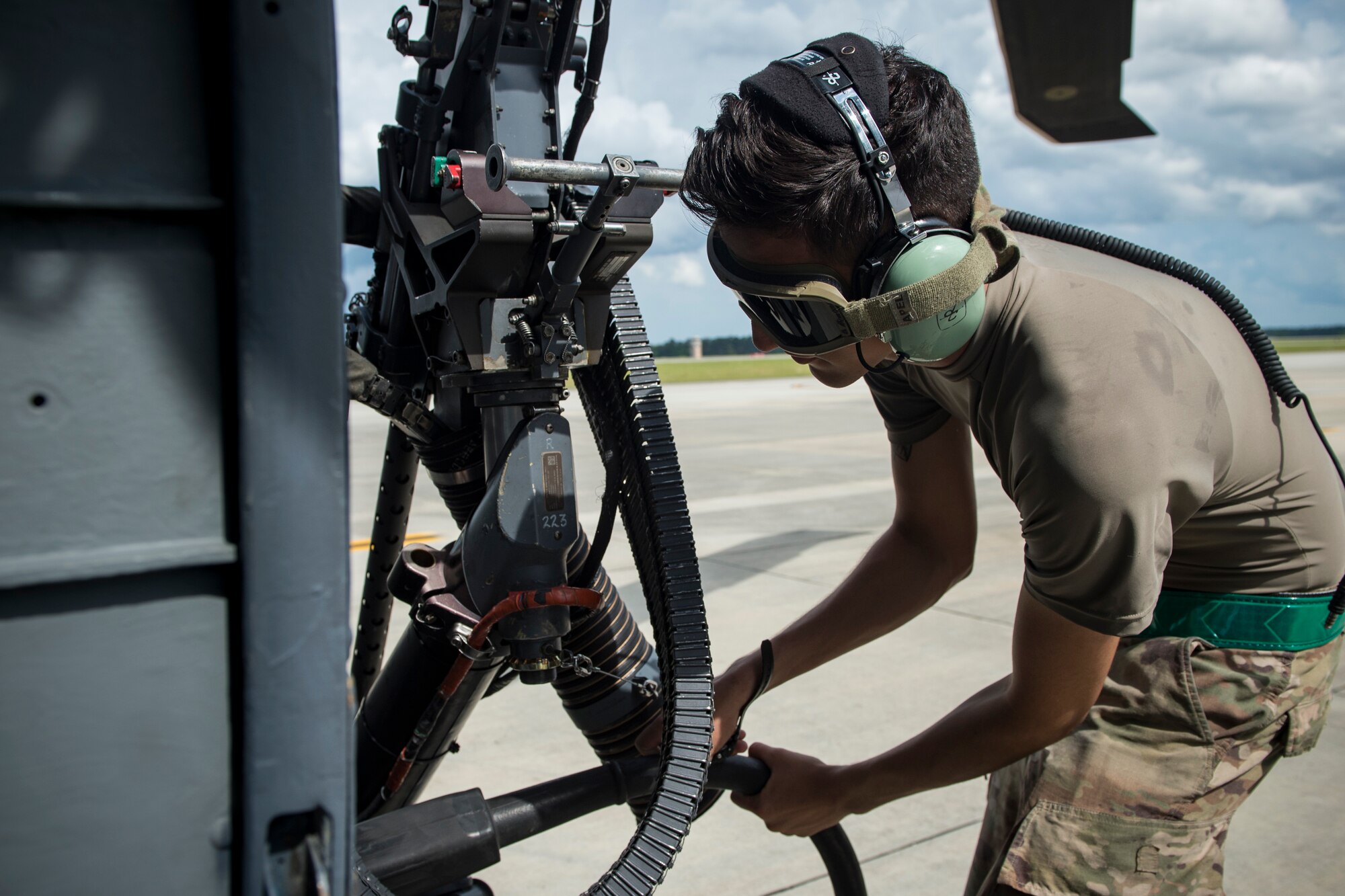 Airman 1st Class Brendan Alicea, 723d Aircraft Maintenance Squadron crew chief, detaches a cord from an HH-60G Pave Hawk prior to flight, May 17, 2018, at Moody Air Force Base, Ga. Airmen conduct routine training missions in the airspace surrounding Moody to remain current on their tactics and procedures. While helping pilots remain proficient, training also gives crew chiefs and maintainers the opportunity to remain proficient at launching and maintaining the aircraft. (U.S. Air Force photo by Senior Airman Janiqua P. Robinson)