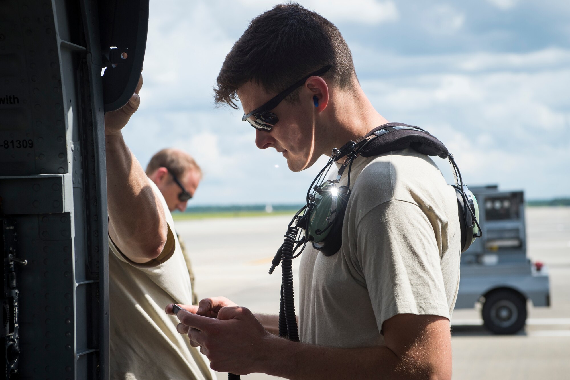 Senior Airman Derek Fischer, 723d Aircraft Maintenance Squadron maintenance specialist, checks a technical order while performing a preflight systems check, May 17, 2018, at Moody Air Force Base, Ga. Airmen conduct routine training missions in the airspace surrounding Moody to remain current on their tactics and procedures. While helping pilots remain proficient, training also gives crew chiefs and maintainers the opportunity to remain proficient at launching and maintaining the aircraft. (U.S. Air Force photo by Senior Airman Janiqua P. Robinson)