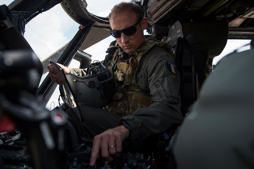 Commandant Micka, a French exchange pilot and assistant director of operations for Moody’s 41st Rescue Squadron, performs a preflight systems check prior to flying an HH-60G Pave Hawk, May 17, 2018, at Moody Air Force Base, Ga. Airmen conduct routine training missions in the airspace surrounding Moody to remain current on their tactics and procedures. While helping pilots remain proficient, training also gives crew chiefs and maintainers the opportunity to remain proficient at launching and maintaining the aircraft. (U.S. Air Force photo by Senior Airman Janiqua P. Robinson)