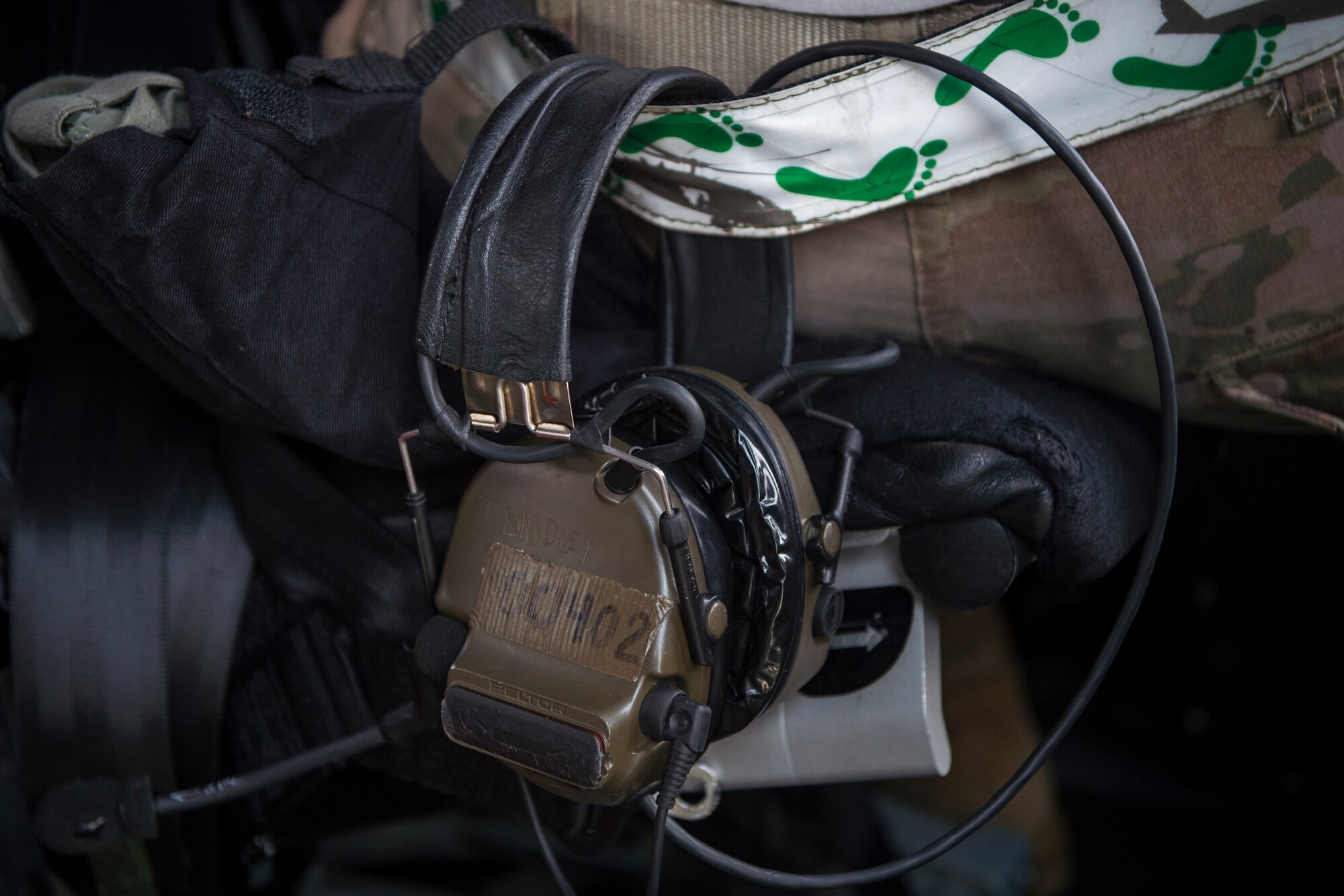 A headset hangs from an Airman’s reflective belt, May 17, 2018, at Moody Air Force Base, Ga. While helping pilots remain proficient, training also gives crew chiefs and maintainers the opportunity to remain proficient at launching and maintaining the aircraft. (U.S. Air Force photo by Senior Airman Janiqua P. Robinson)